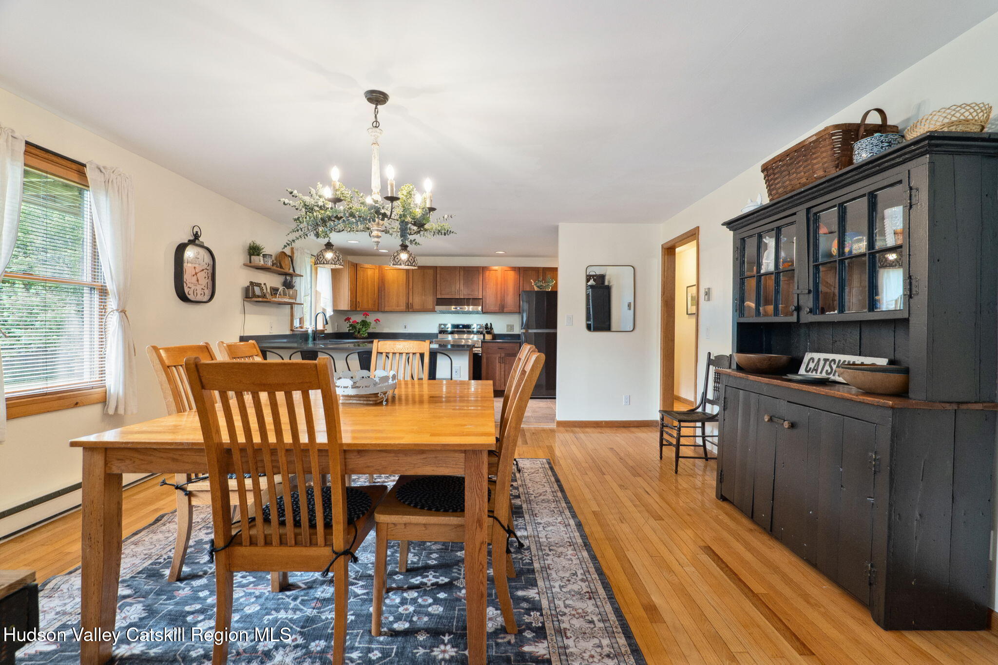 552 Bear Kill Road Gilboa, NY 12076 - Photo 26 of 63 a dining room with furniture a window and a chandelier
