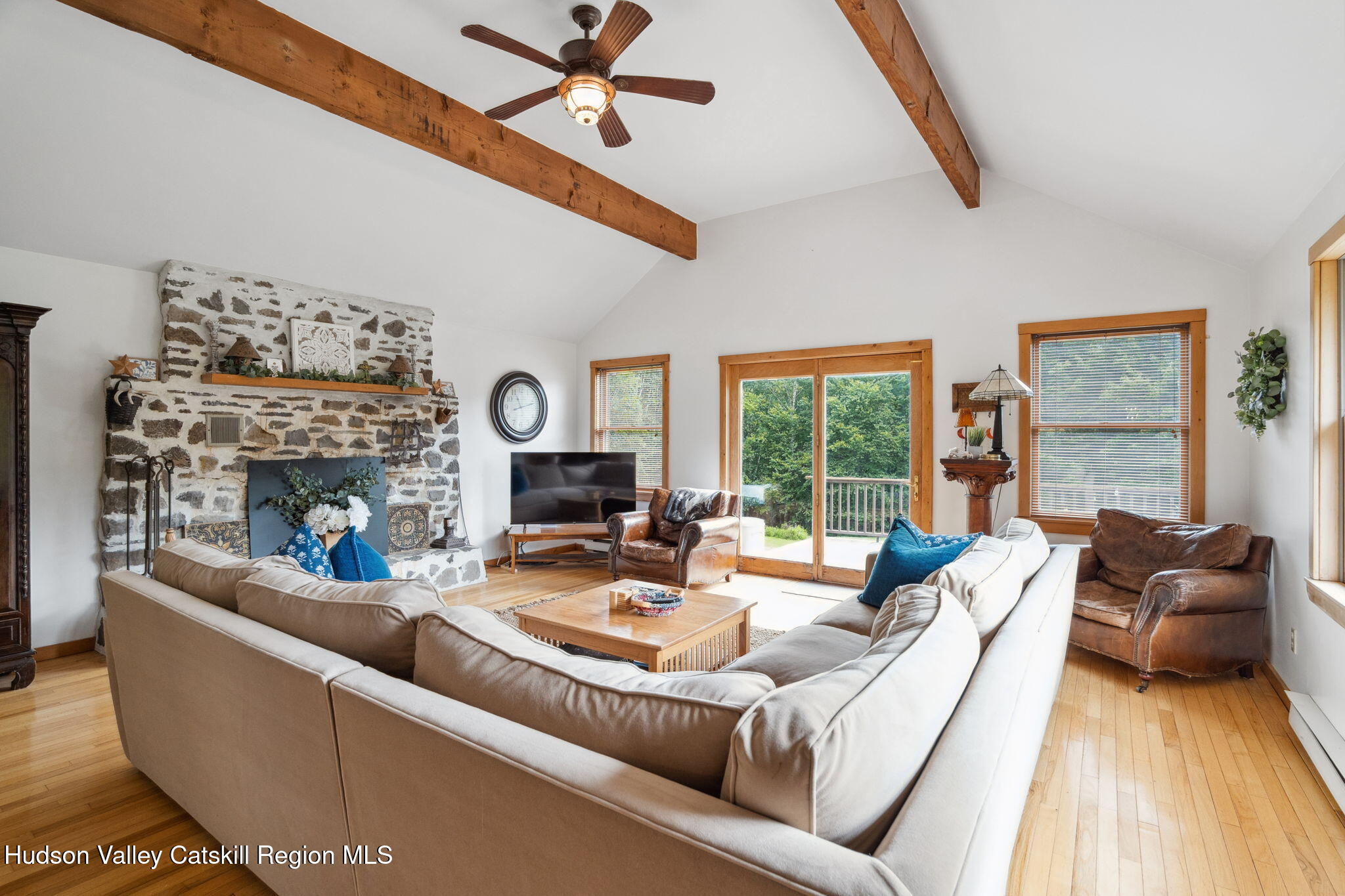 552 Bear Kill Road Gilboa, NY 12076 - Photo 29 of 63 a living room with furniture fireplace and a large window
