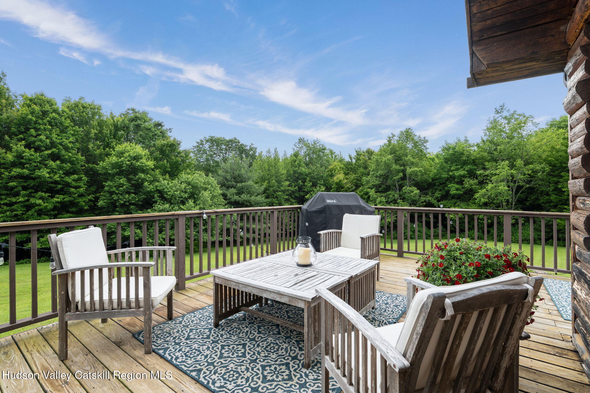 552 Bear Kill Road Gilboa, NY 12076 - Photo 33 of 63 a view of a deck with two chair and a potted plant