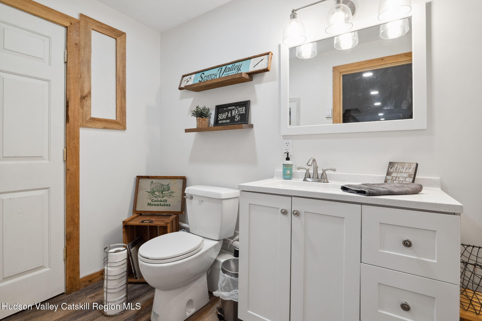 552 Bear Kill Road Gilboa, NY 12076 - Photo 52 of 63 a bathroom with a toilet sink and mirror