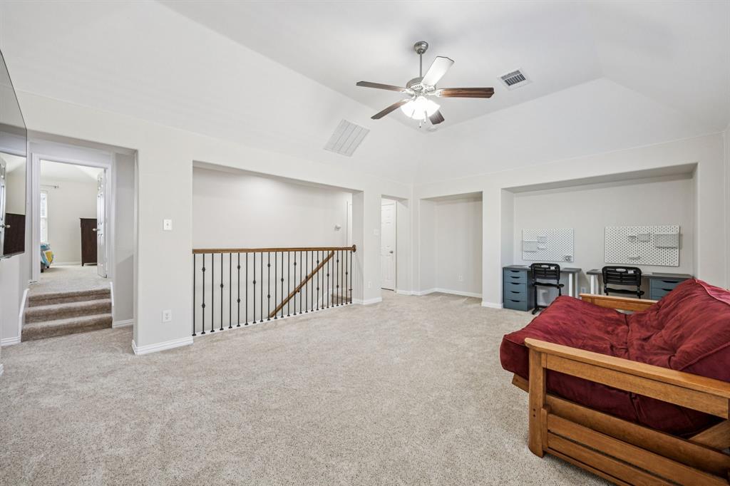 1013 Knoxbridge Road Forney, TX 75126 - Photo 23 of 39 a living room with furniture and white walls