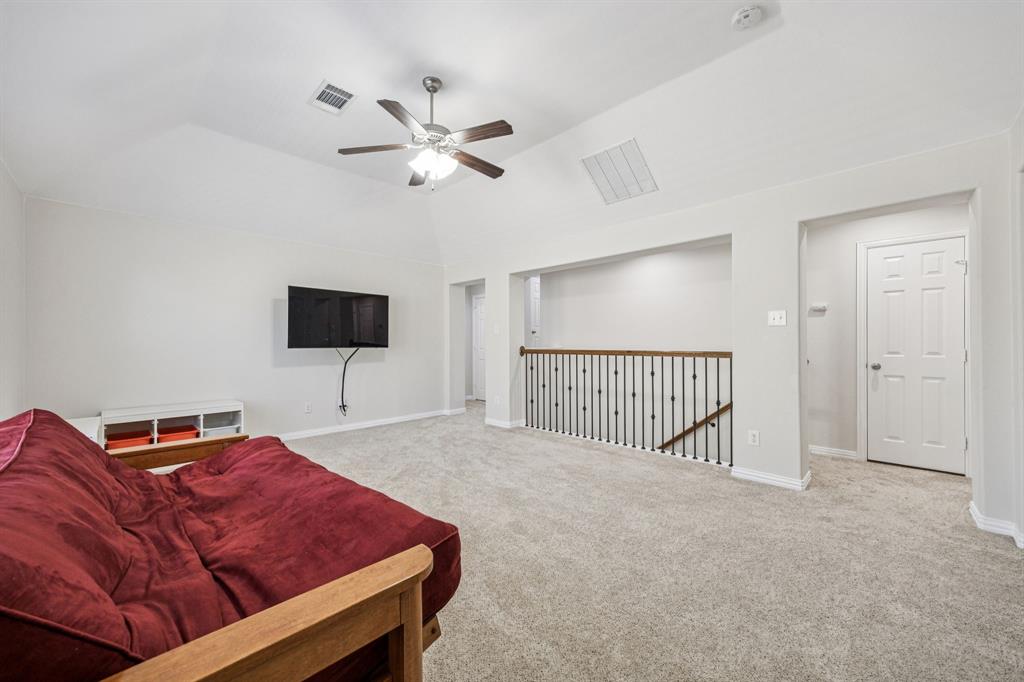 1013 Knoxbridge Road Forney, TX 75126 - Photo 24 of 39 a bed room with a bed and a television