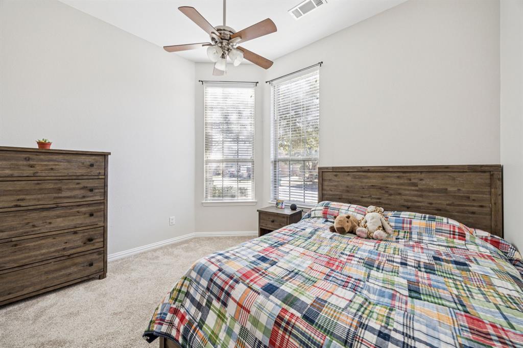 1013 Knoxbridge Road Forney, TX 75126 - Photo 26 of 39 a bedroom with a bed and a window