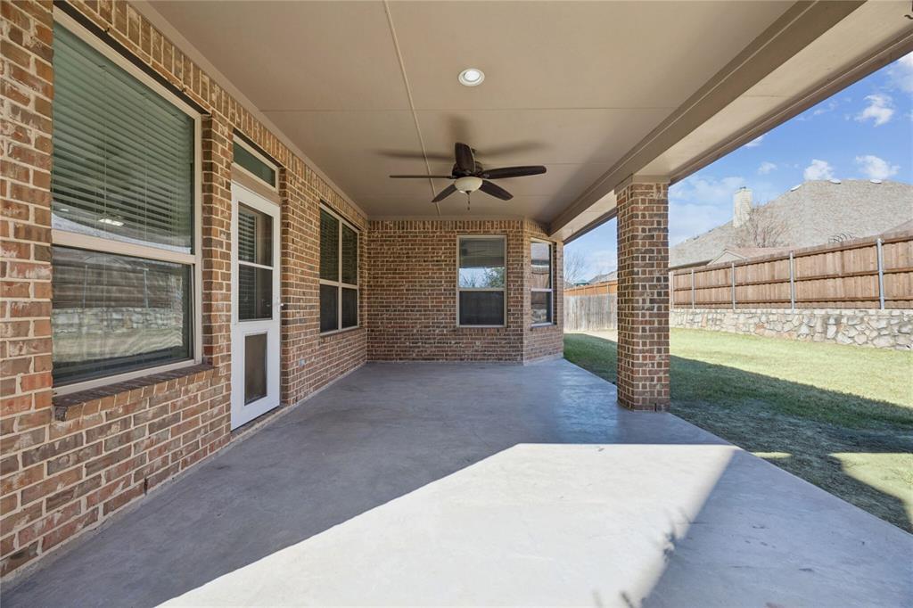1013 Knoxbridge Road Forney, TX 75126 - Photo 32 of 39 a view of a porch with a table and chairs