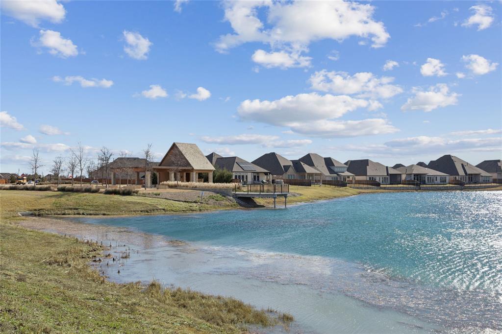 1013 Knoxbridge Road Forney, TX 75126 - Photo 37 of 39 a view of a lake with houses in the back