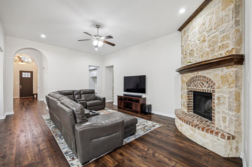 1013 Knoxbridge Road Forney, TX 75126 - Photo 8 of 39 a living room with furniture and a fireplace