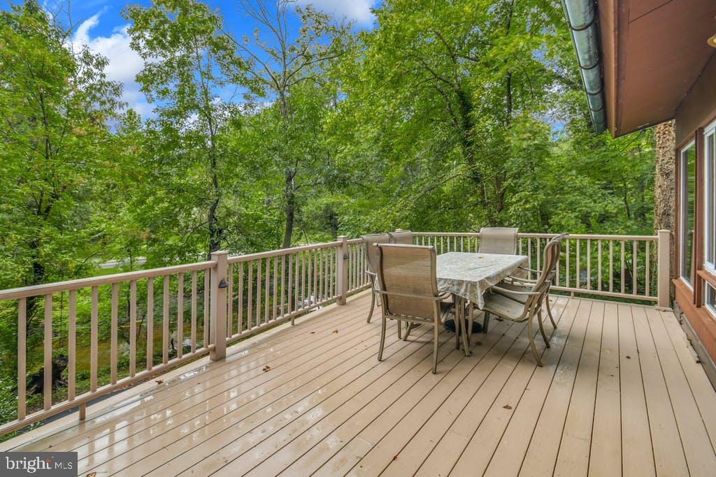 111 Ashmead Road Cheltenham, PA 19012 - Photo 17 of 18 a view of a deck with table and chairs and wooden floor