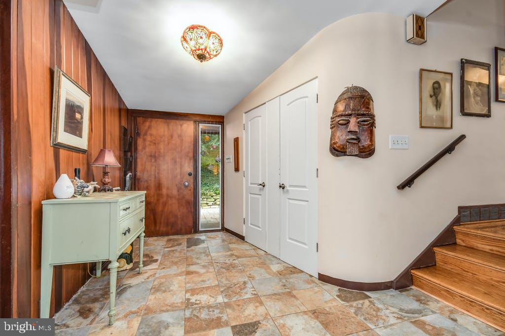 111 Ashmead Road Cheltenham, PA 19012 - Photo 4 of 18 a view of a hallway with workspace and windows