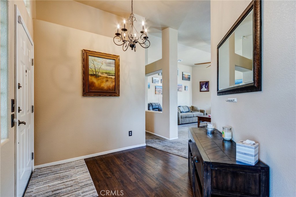 7170 Joshua Road Oak Hills, CA 92344 - Photo 25 of 59 a view of a livingroom with furniture wooden floor and window