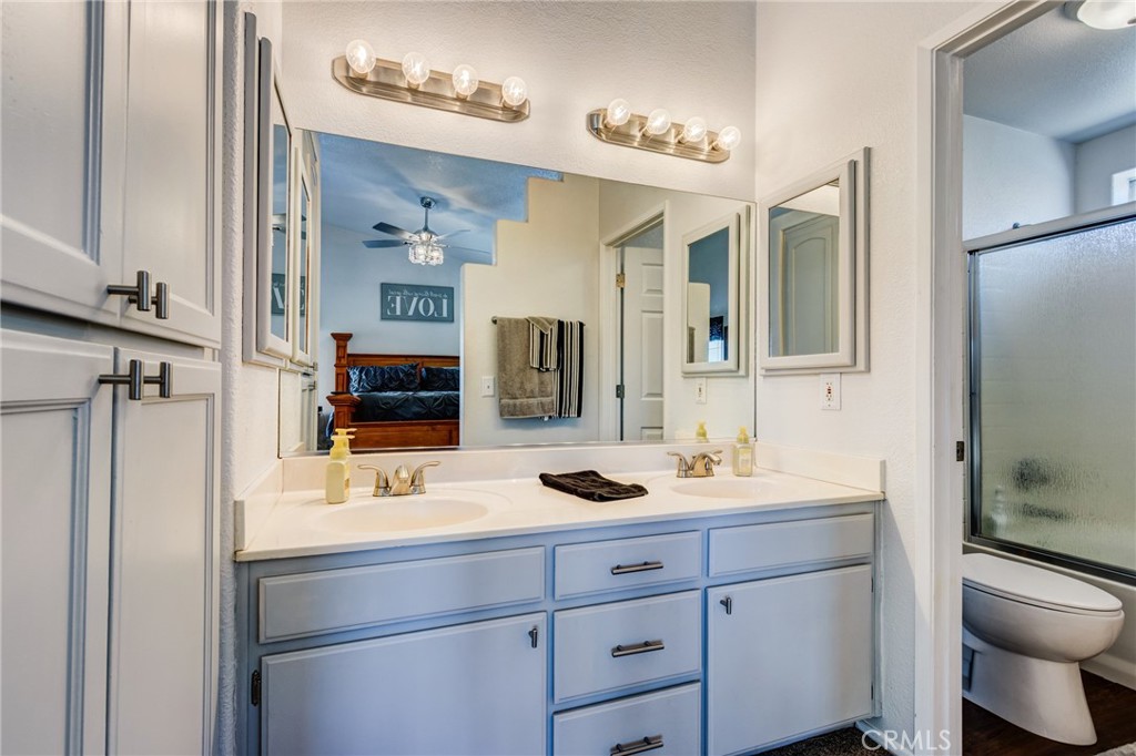 7170 Joshua Road Oak Hills, CA 92344 - Photo 43 of 59 a bathroom with a sink and a mirror
