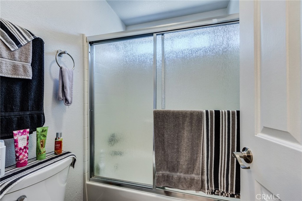 7170 Joshua Road Oak Hills, CA 92344 - Photo 44 of 59 a bathroom with a shower and a sink