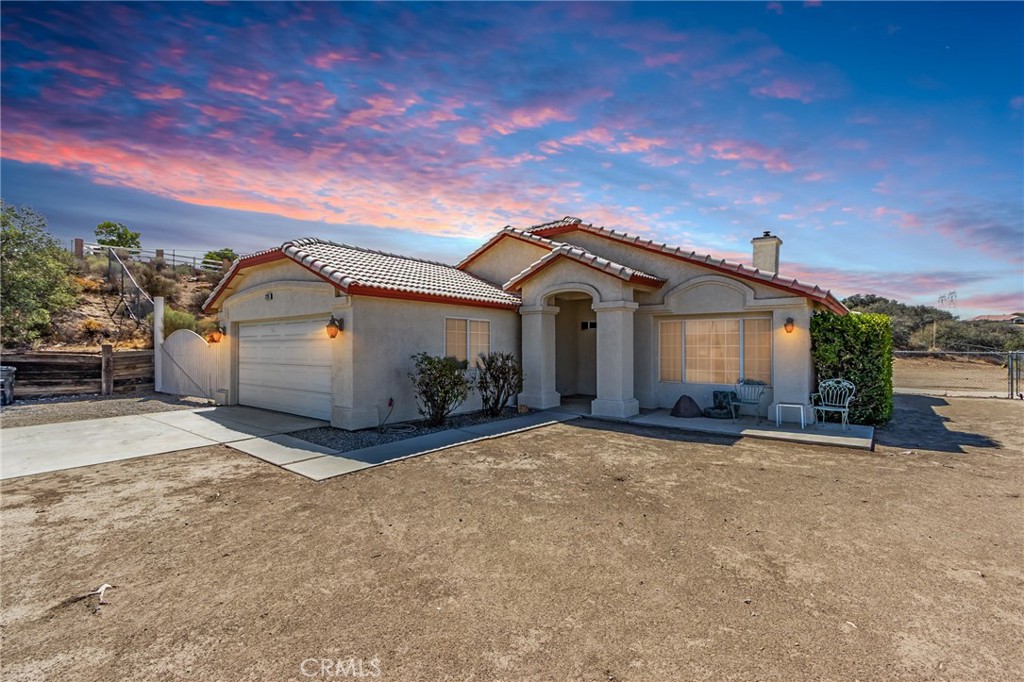7170 Joshua Road Oak Hills, CA 92344 - Photo 10 of 59 a view of a house with a patio