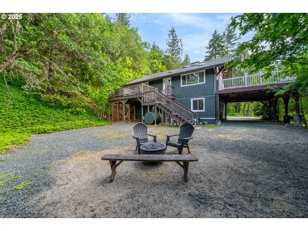 a view of a backyard with a sitting area