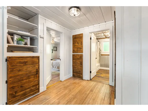 a view of an entryway with wooden floor