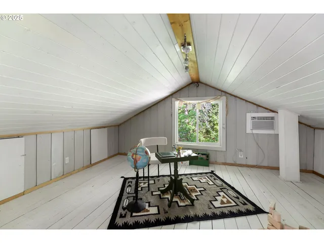 a view of a room with furniture and window