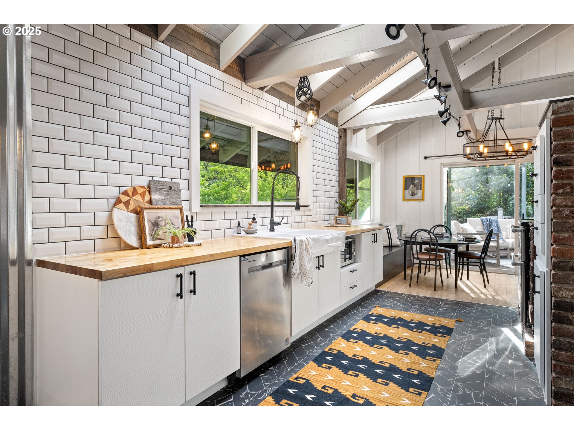 988 Savage Creek Road Grants Pass, OR 97527 - Photo 21 of 48 a open kitchen with granite countertop a sink and white cabinets