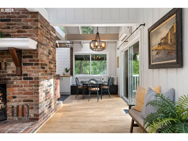 a sitting area with furniture and windows