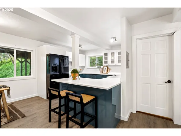 a kitchen with a table and chairs