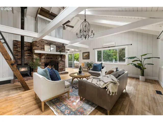 a living room with furniture or outdoor dining table and a fireplace