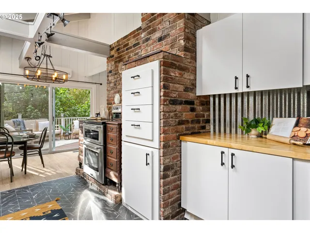 a living room with furniture a flat screen tv and a table