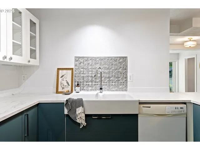 a bathroom with a sink vanity granite tub and a mirror
