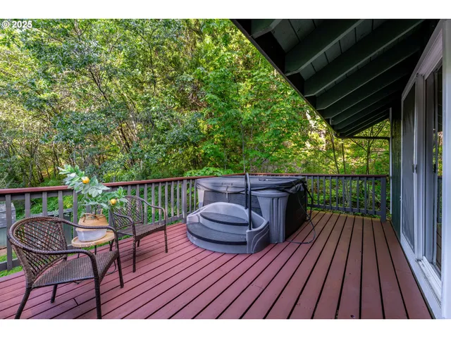 a view of balcony with wooden floor and outdoor seating