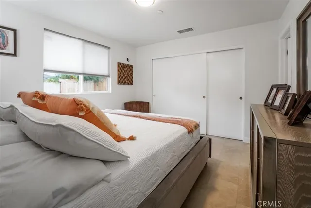 a living room with furniture and flowers