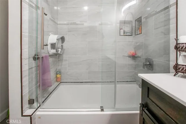 a kitchen with stainless steel appliances a refrigerator sink and cabinets