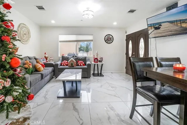 a bedroom with pink walls and pink bed