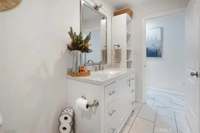 a yellow house with trees in front of it