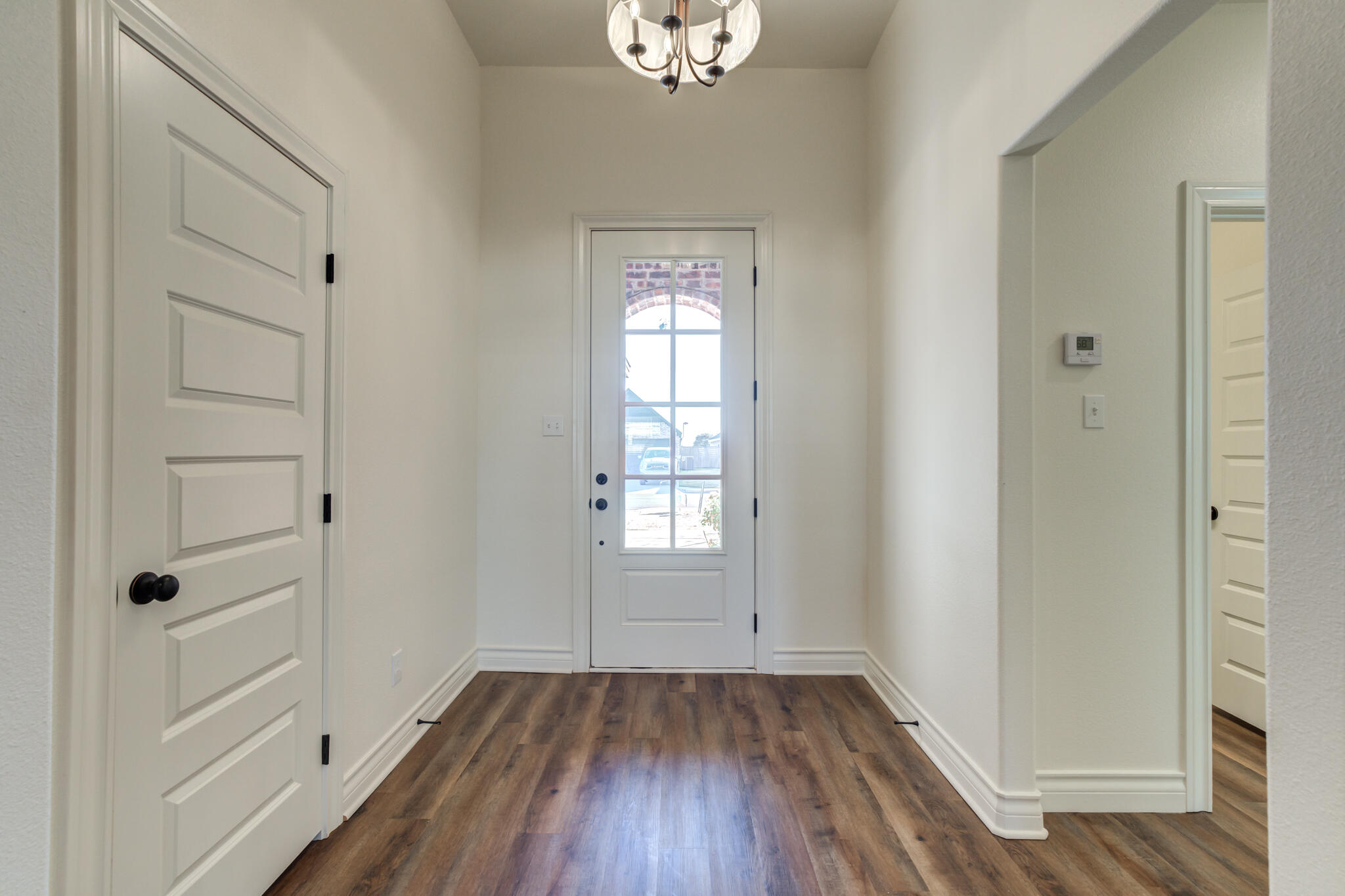 3710 144th Street Lubbock, TX 79423 - Photo 11 of 53 wooden floor in an empty room with a window