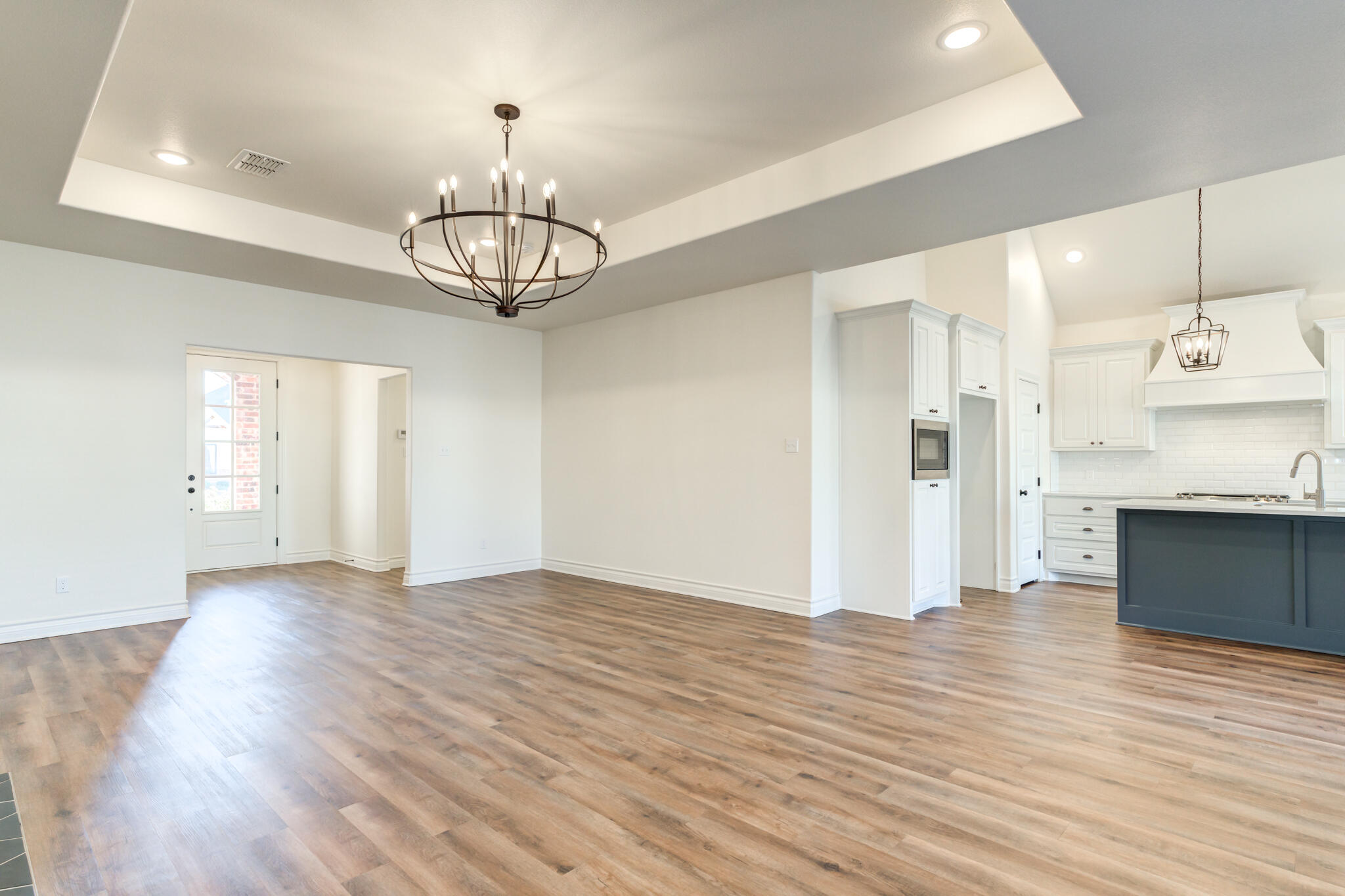 3710 144th Street Lubbock, TX 79423 - Photo 17 of 53 a view of a kitchen with wooden floor and a sink