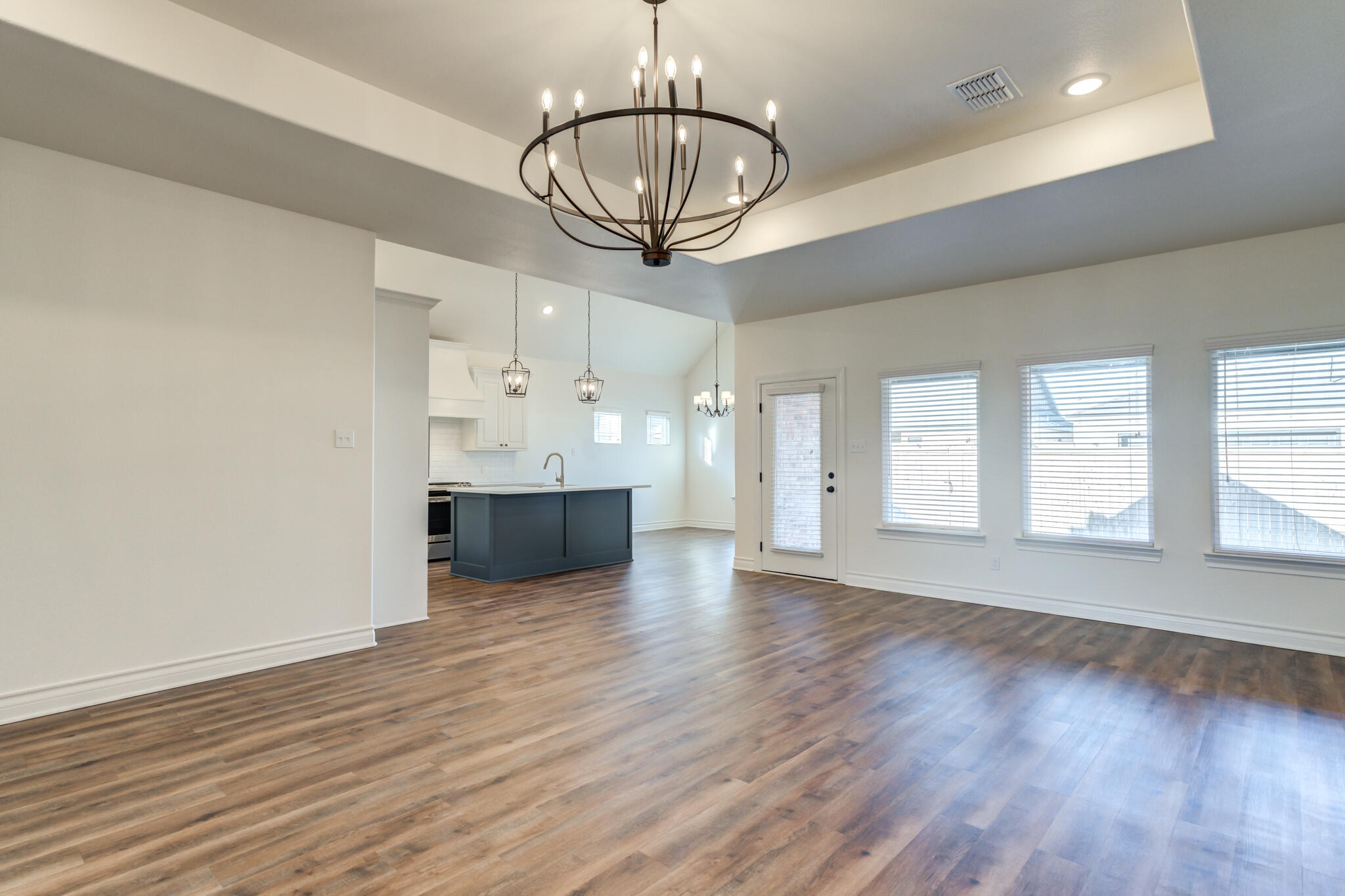 3710 144th Street Lubbock, TX 79423 - Photo 19 of 53 a view of a kitchen with wooden floor and a kitchen