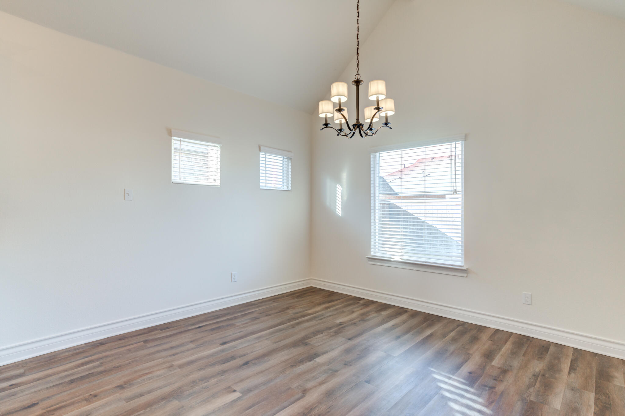 3710 144th Street Lubbock, TX 79423 - Photo 22 of 53 a view of empty room with wooden floor and window