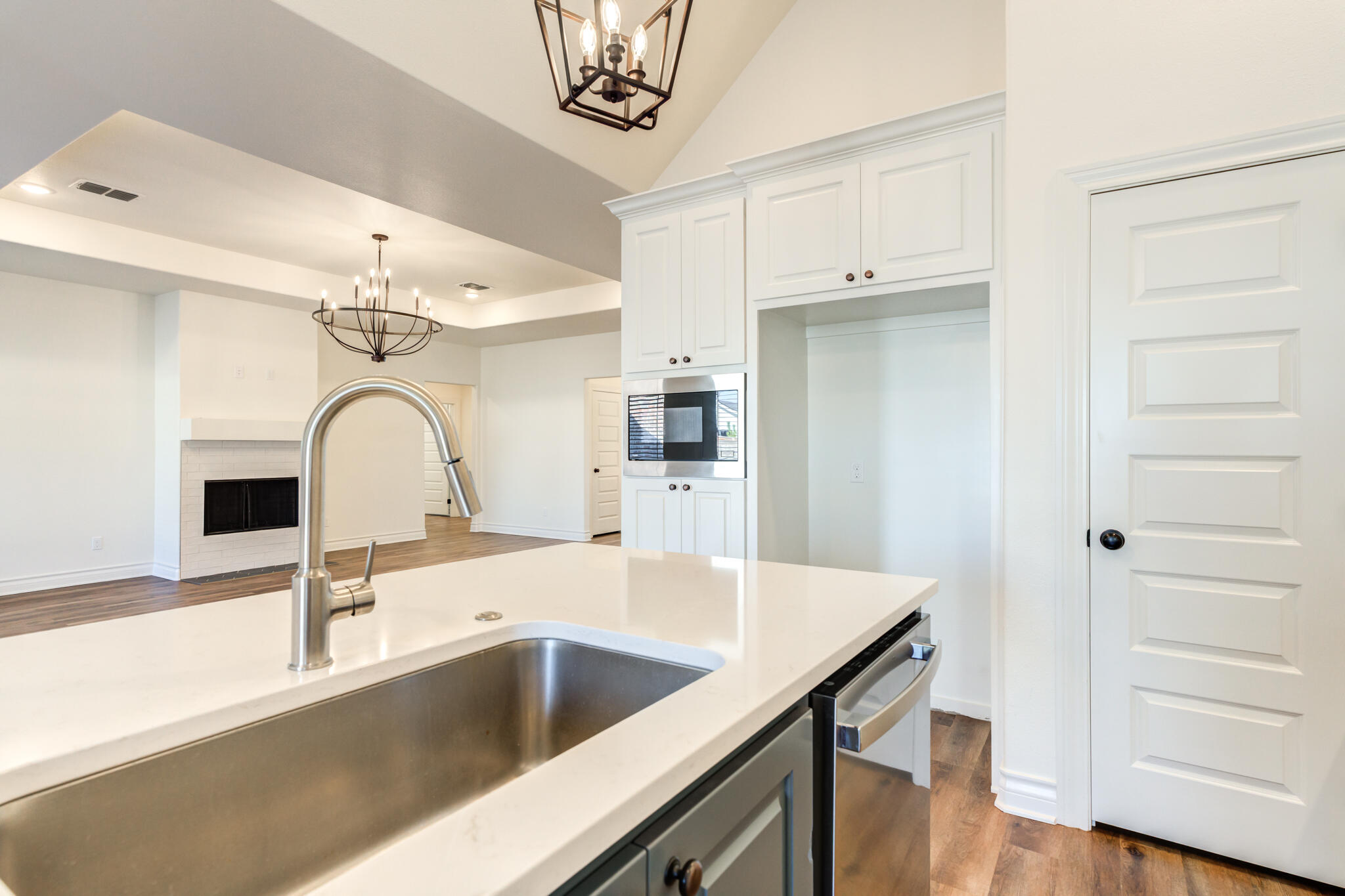 3710 144th Street Lubbock, TX 79423 - Photo 27 of 53 a kitchen with a refrigerator and a sink