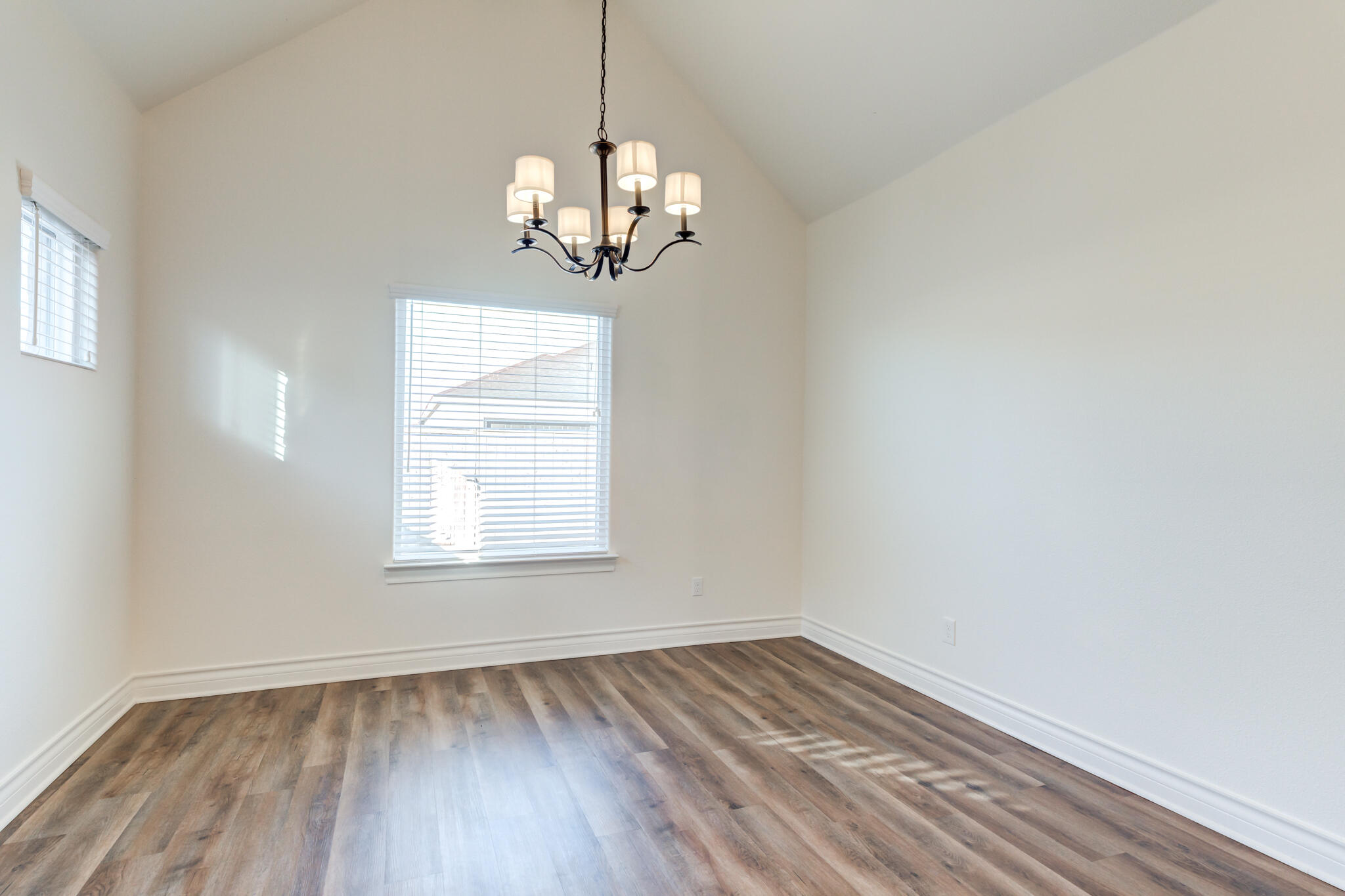 3710 144th Street Lubbock, TX 79423 - Photo 29 of 53 a view of empty room with wooden floor and window