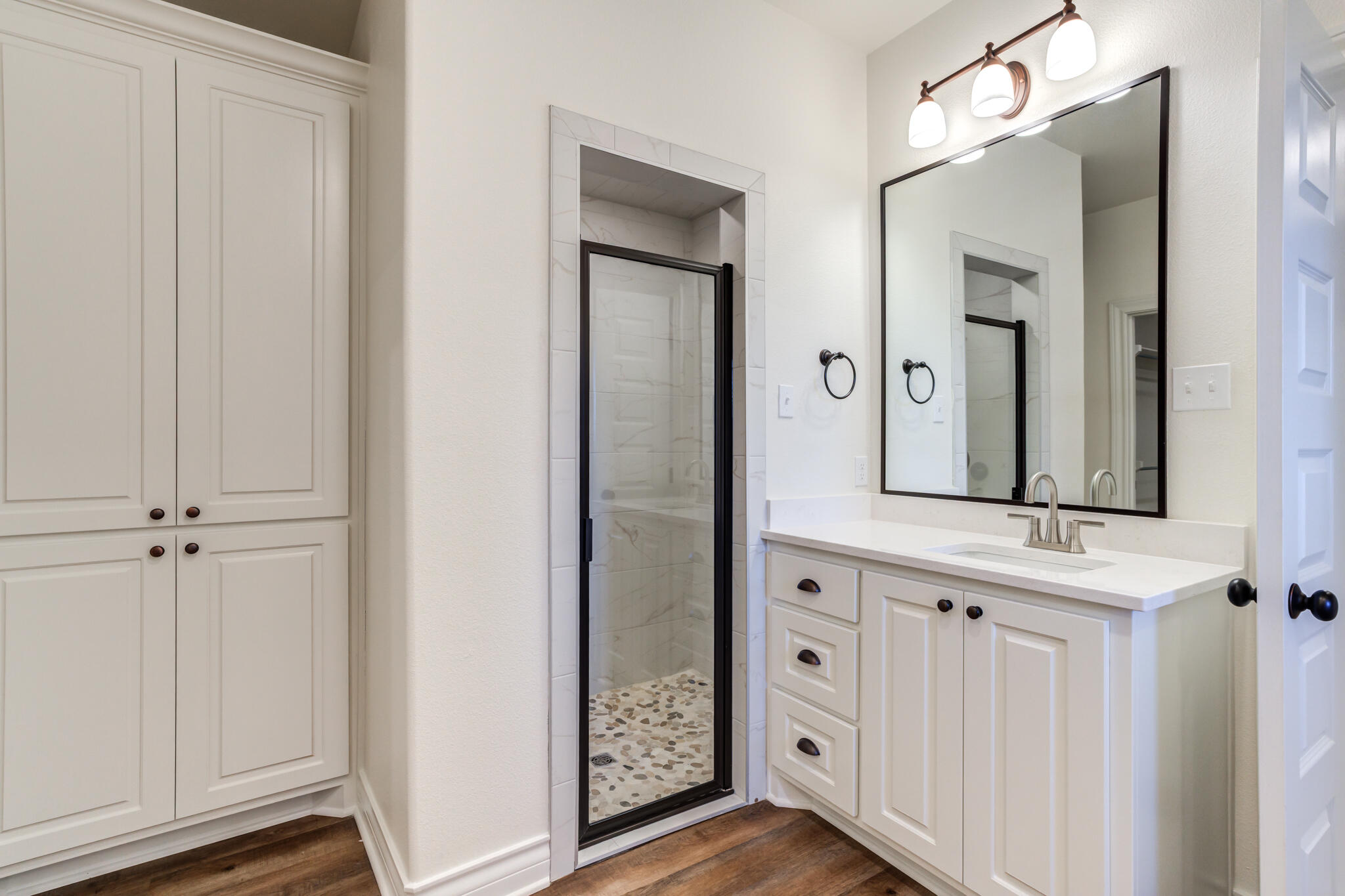 3710 144th Street Lubbock, TX 79423 - Photo 33 of 53 a bathroom with a double vanity sink and a mirror