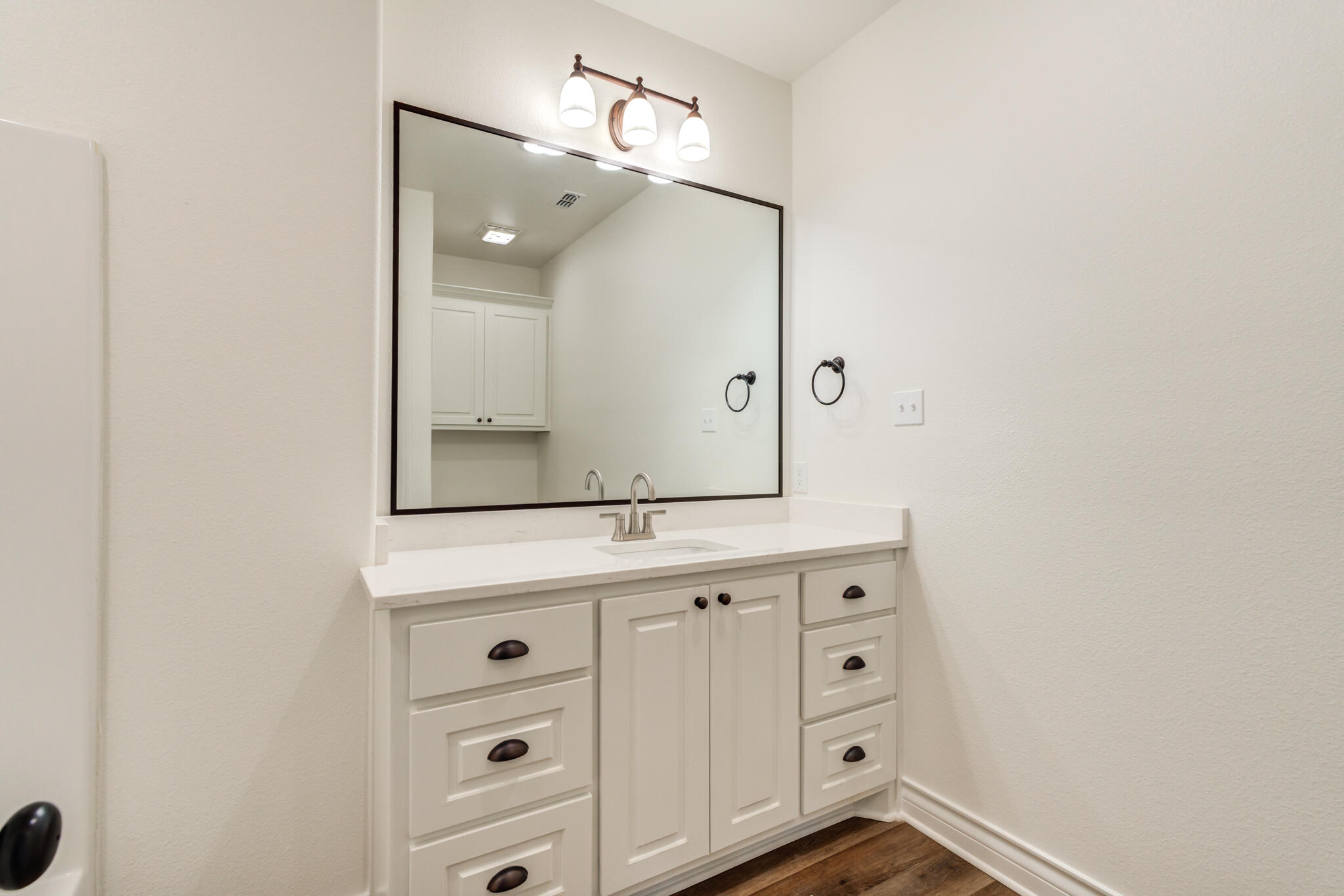 3710 144th Street Lubbock, TX 79423 - Photo 48 of 53 a bathroom with a granite countertop sink and a mirror