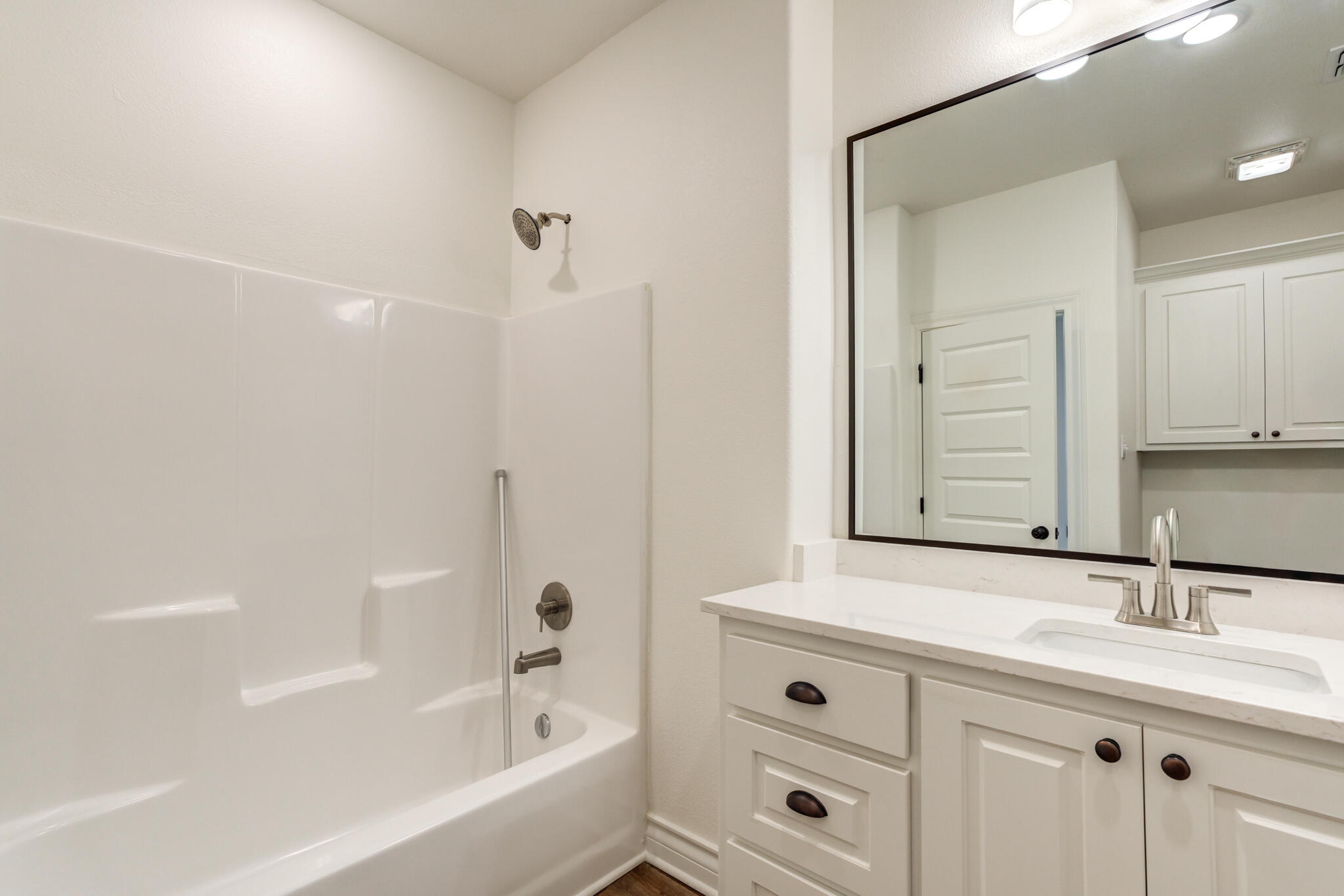3710 144th Street Lubbock, TX 79423 - Photo 49 of 53 a bathroom with a bathtub and a sink