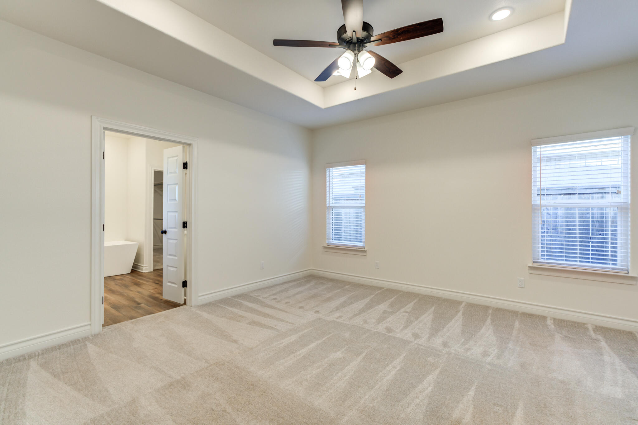 3710 144th Street Lubbock, TX 79423 - Photo 7 of 53 wooden floor in an empty room with a window