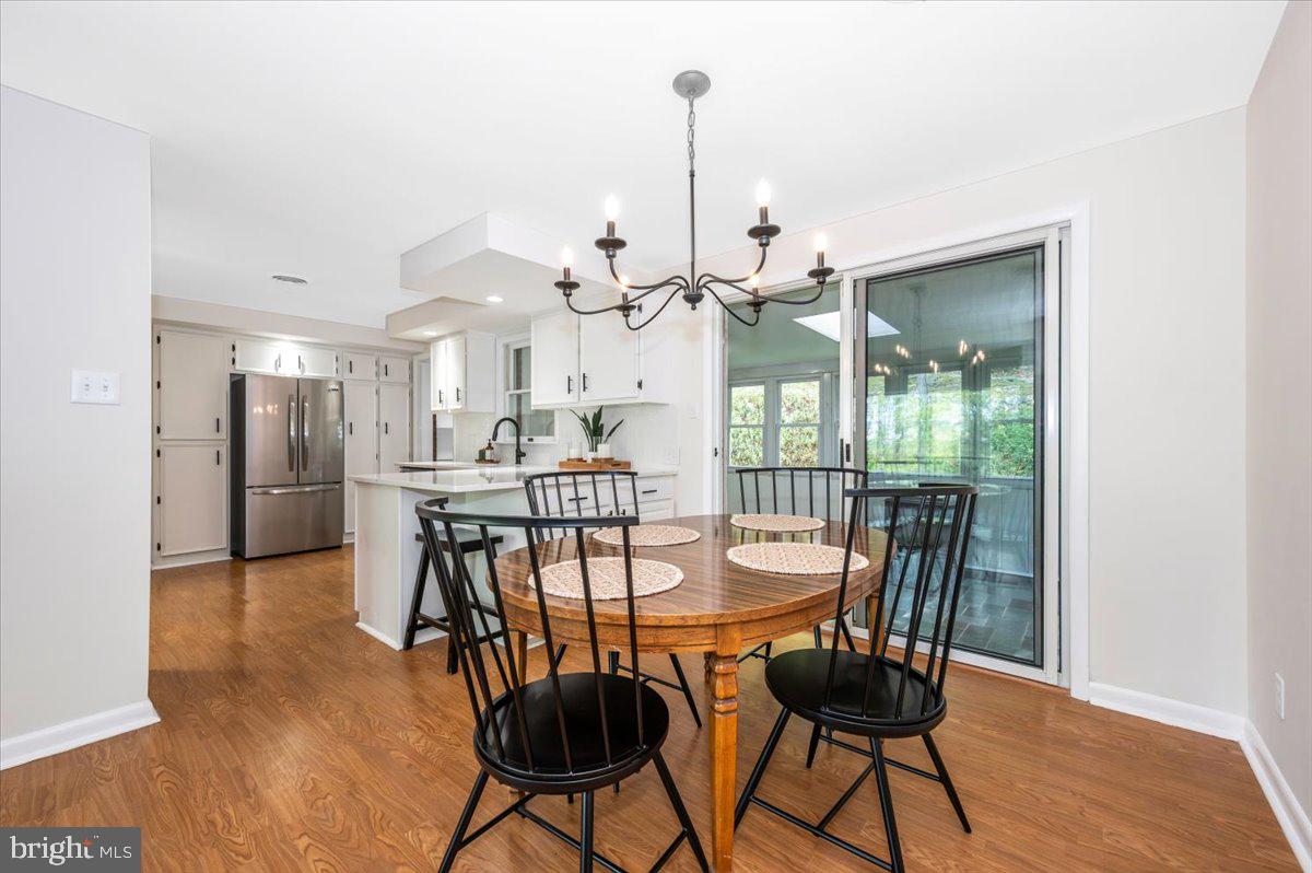 13449 Edgemont Road Smithsburg, MD 21783 - Photo 11 of 70 a view of a dining room with furniture and wooden floor