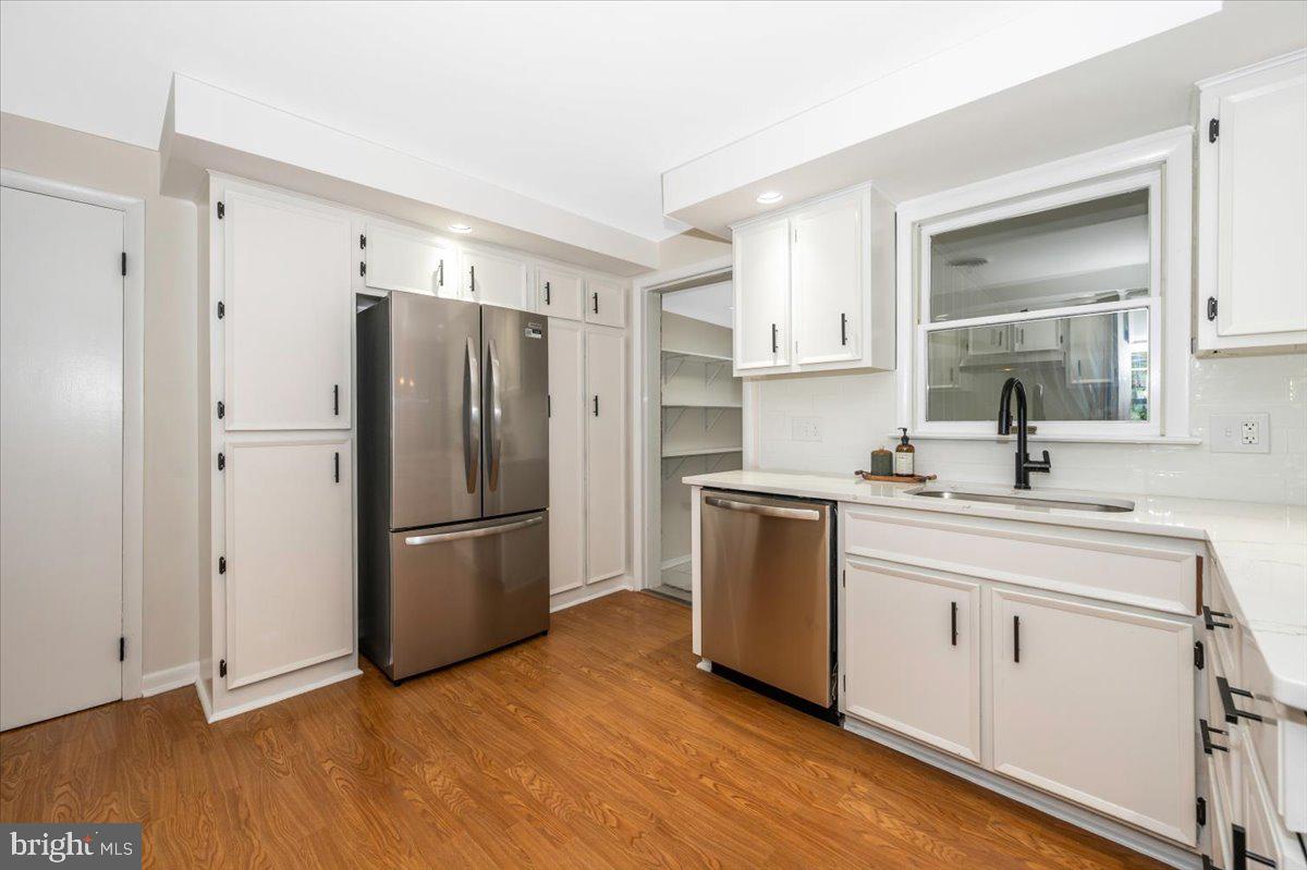 13449 Edgemont Road Smithsburg, MD 21783 - Photo 16 of 70 a kitchen with a refrigerator cabinets and wooden floor
