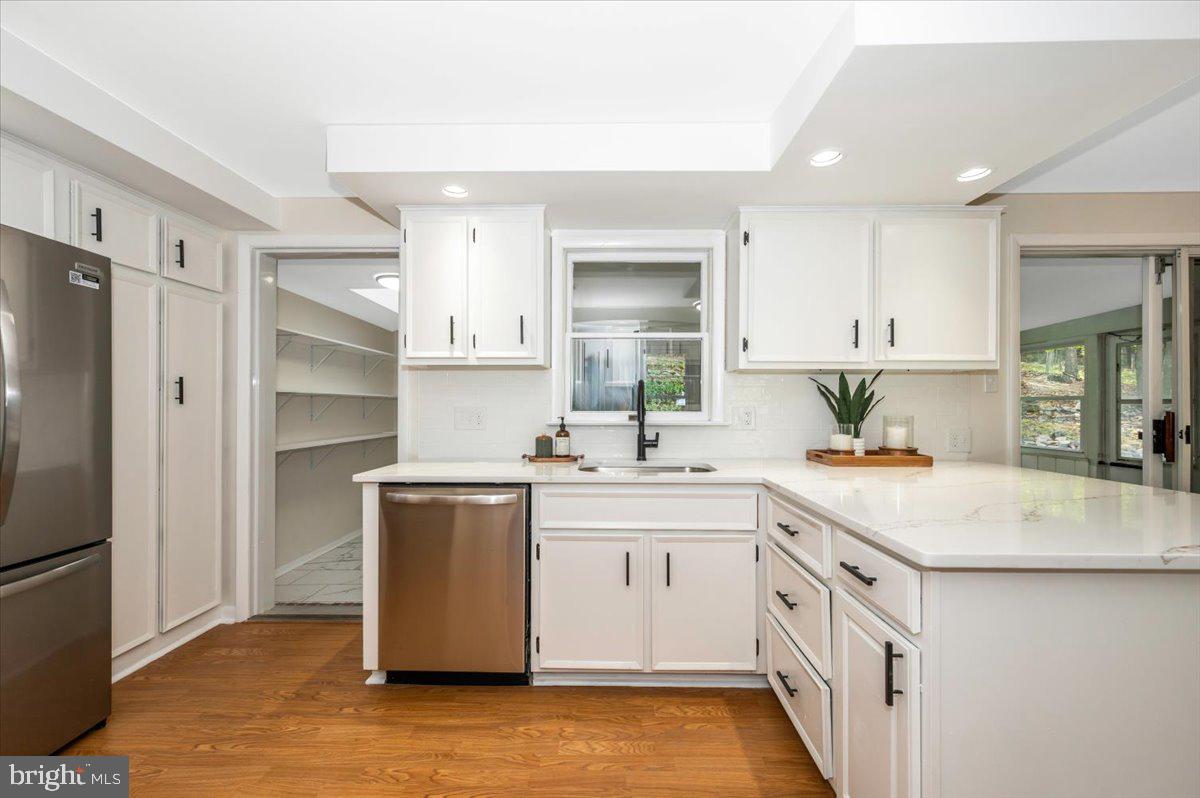 13449 Edgemont Road Smithsburg, MD 21783 - Photo 17 of 70 a kitchen with a sink stove and refrigerator
