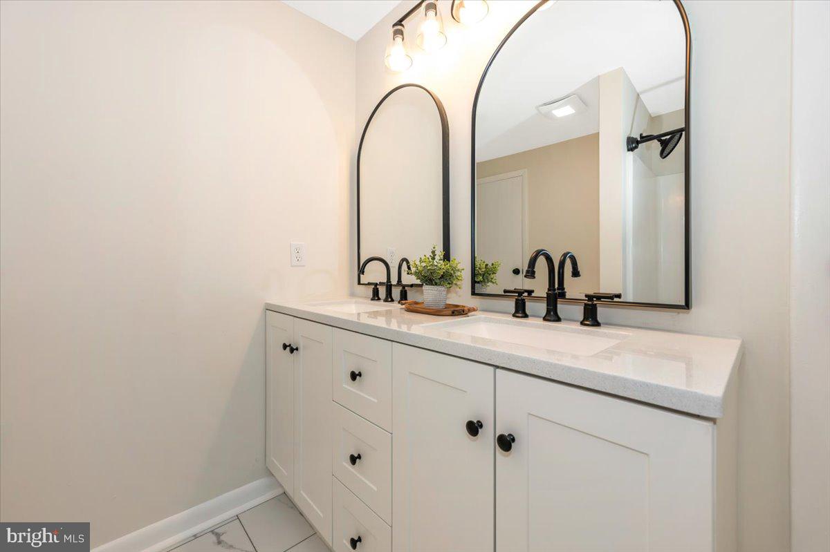 13449 Edgemont Road Smithsburg, MD 21783 - Photo 37 of 70 a bathroom with a sink and a mirror