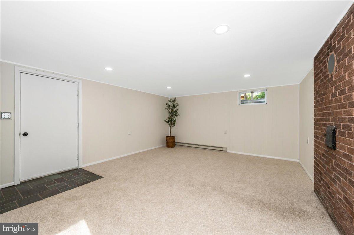 13449 Edgemont Road Smithsburg, MD 21783 - Photo 40 of 70 a view of an empty room with a fireplace
