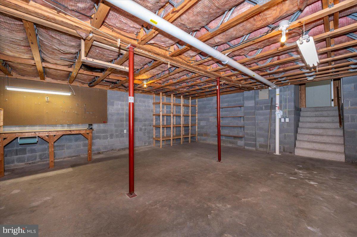 13449 Edgemont Road Smithsburg, MD 21783 - Photo 44 of 70 a view of a room with wooden shelves