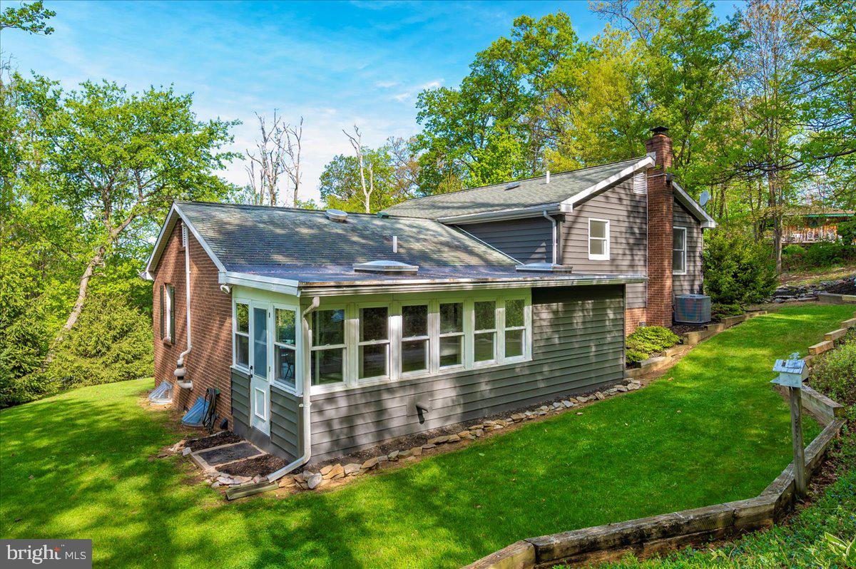 13449 Edgemont Road Smithsburg, MD 21783 - Photo 46 of 70 front view of a house with a yard