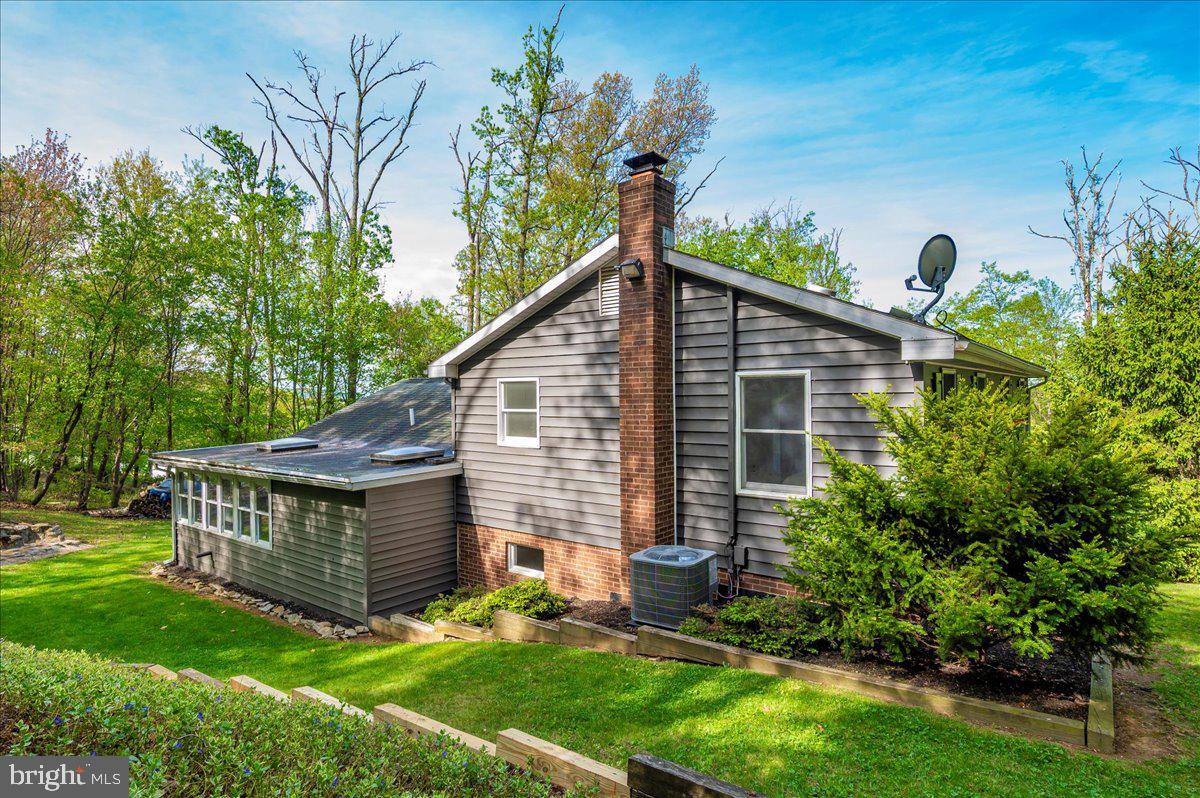 13449 Edgemont Road Smithsburg, MD 21783 - Photo 48 of 70 a view of a house with a yard