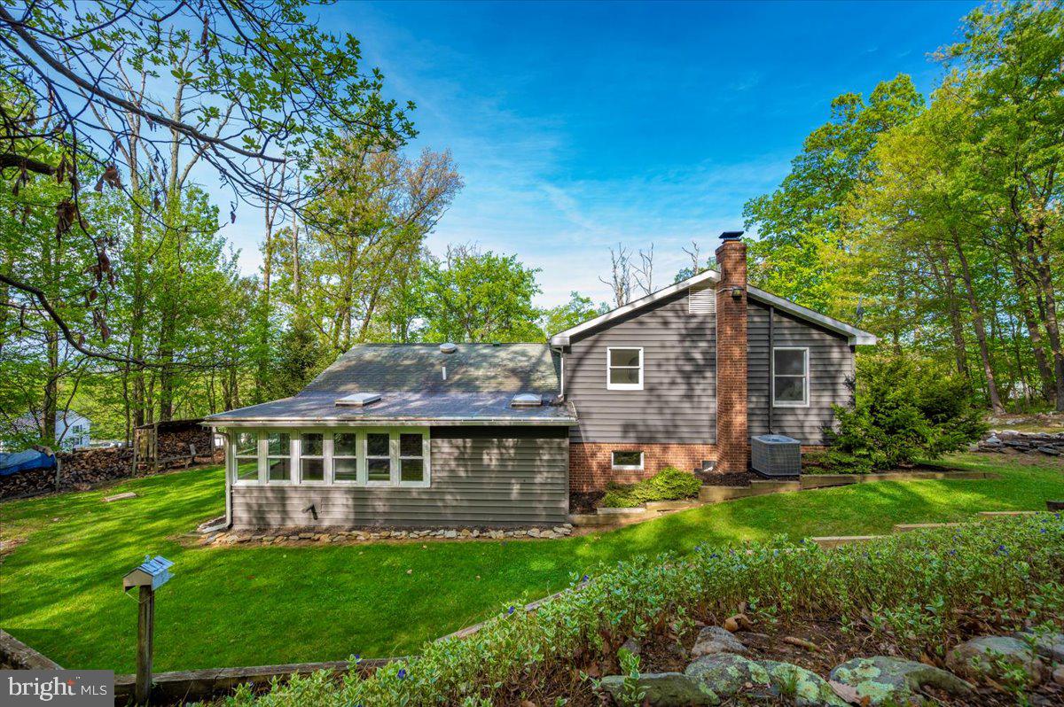 13449 Edgemont Road Smithsburg, MD 21783 - Photo 50 of 70 a view of a house with a big yard potted plants and large tree