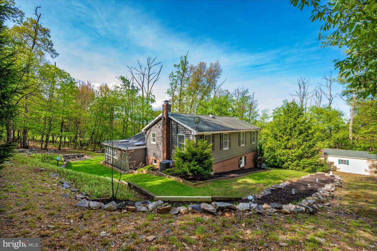 13449 Edgemont Road Smithsburg, MD 21783 - Photo 52 of 70 a view of a house with a big yard plants and large trees